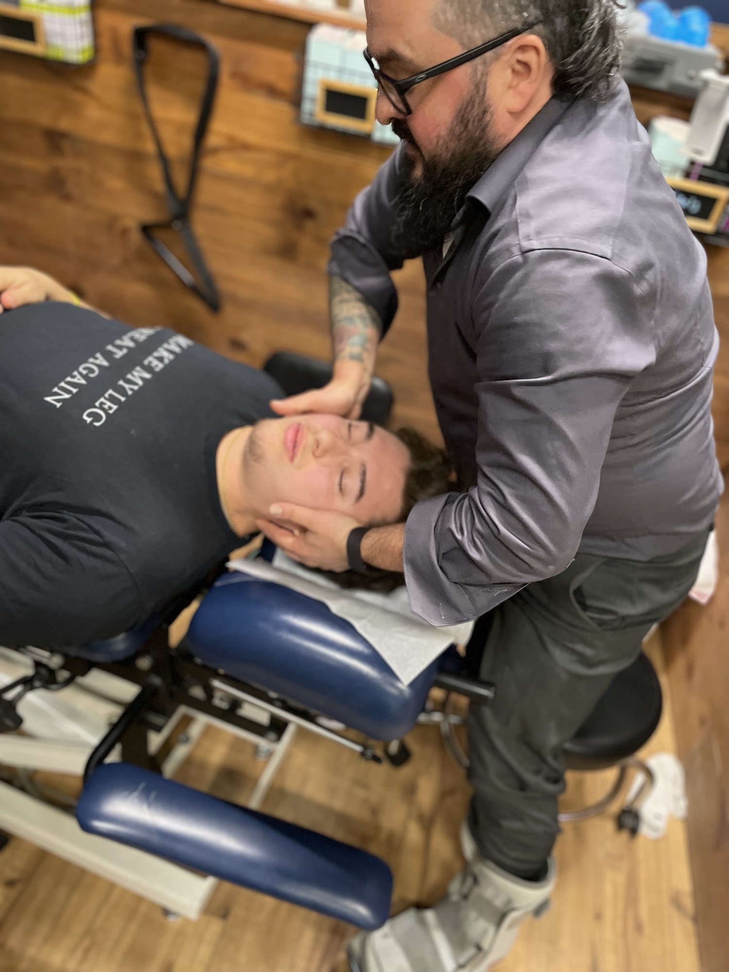 Hands-on chiropractic treatment being provided on a treatment table at Boundless in Bottineau