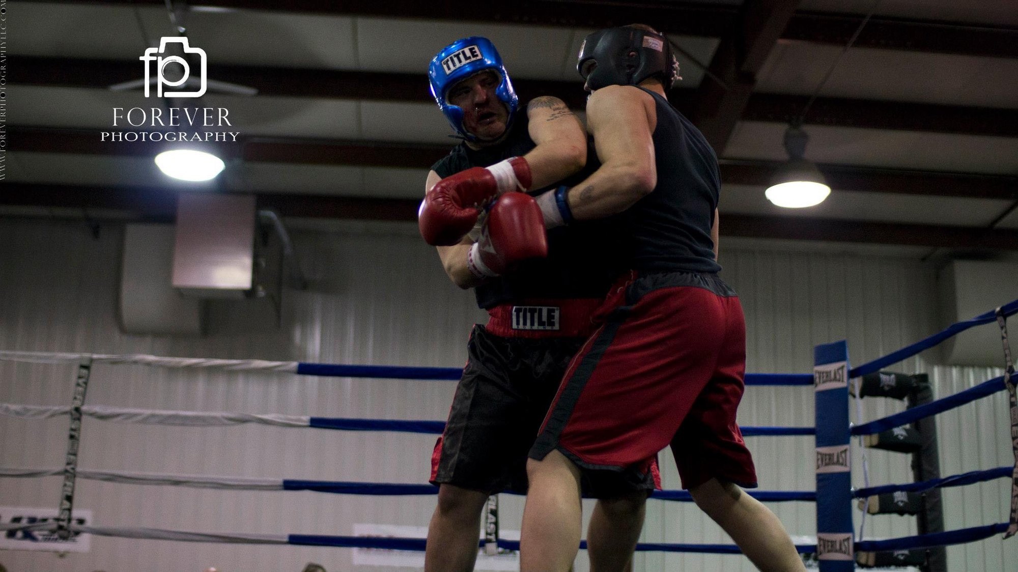 Boxers training in a boxing ring during an active sports event