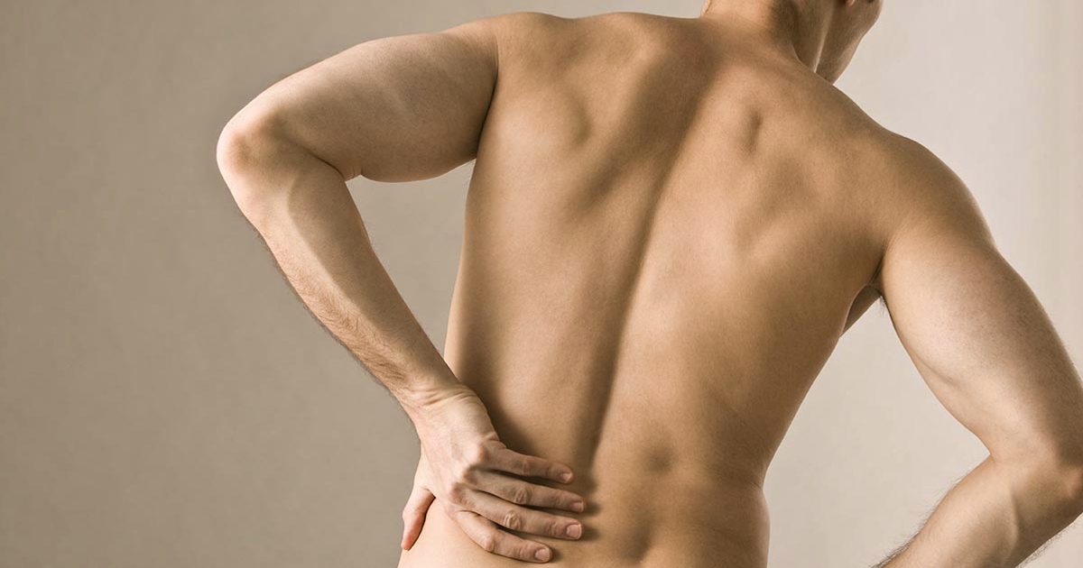 Man experiencing back pain seeking pain relief treatment for it in Salem, Oregon