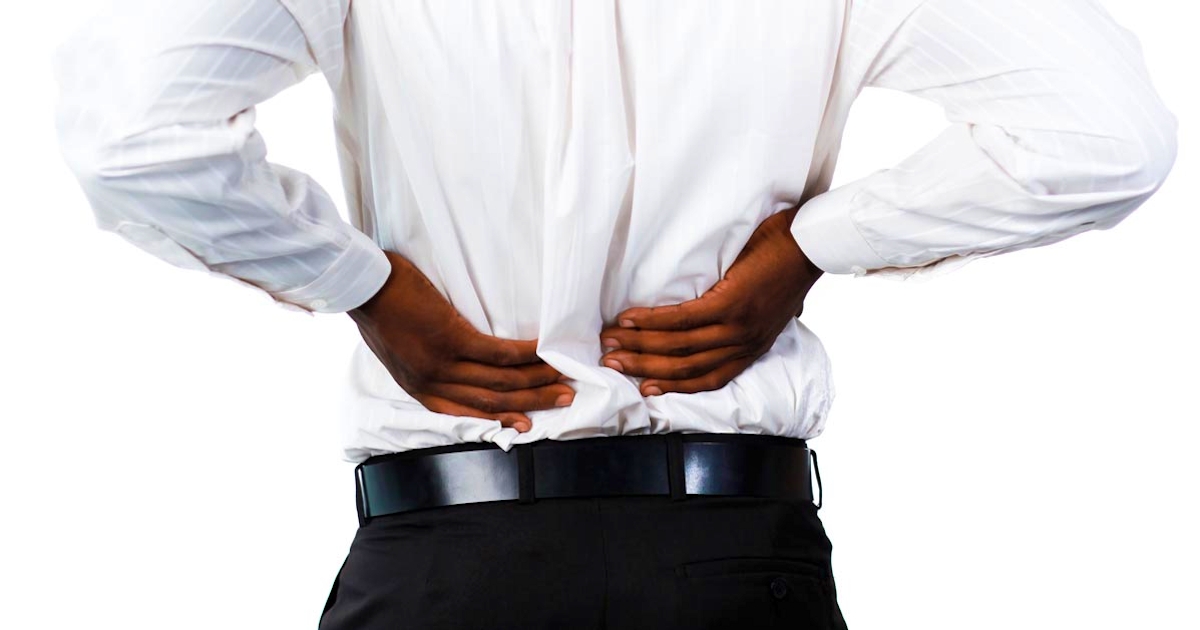 A man experiencing back pain seeking treatment for it in Salem, Oregon