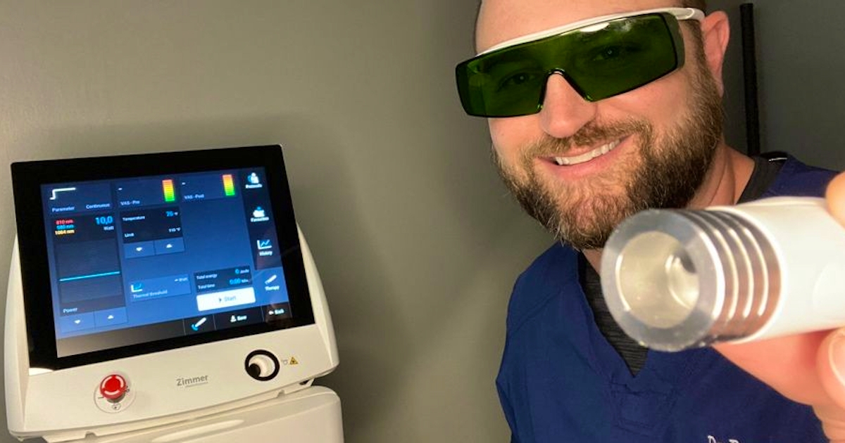 Dr Brent Smarinsky DC with a class 4 laser