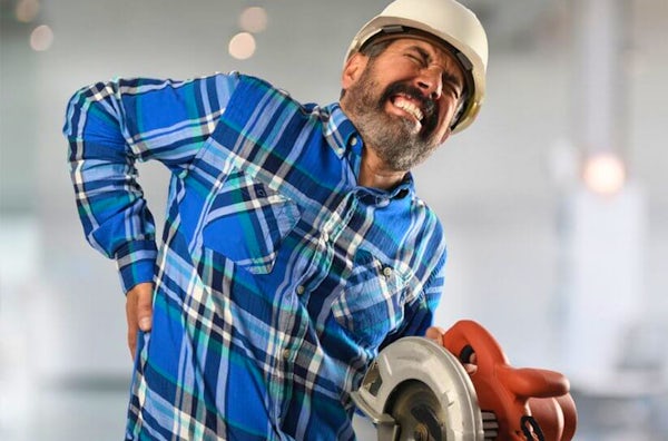 construction worker experiencing back pain
