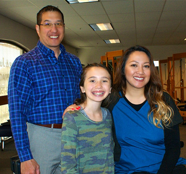 Dr. Jung with his family in the office of Jung Chiropractic in Pinole, CA