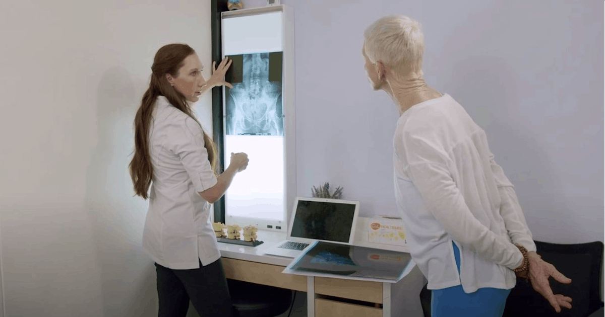 dr schiller reading x-rays and chiropractic adjustment
