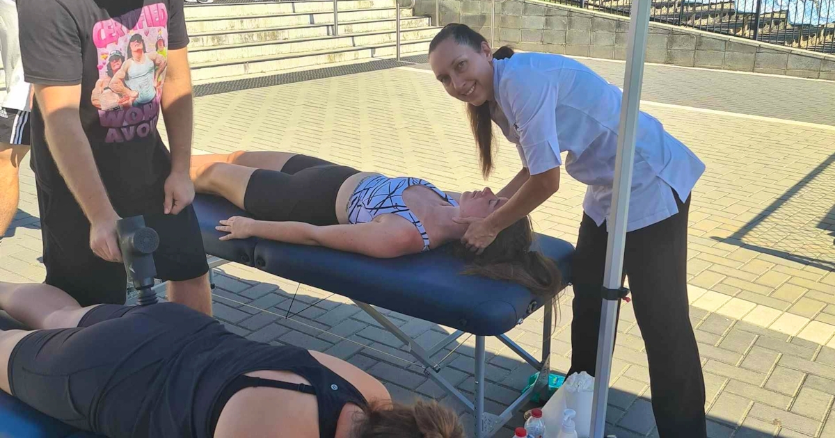 Dr. Linda Schiller and Lakeside Chiropractic team providing chiropractic care to athletes at FitSpot event in Joondalup