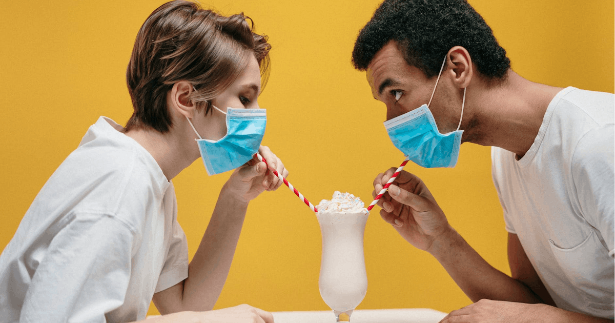 MASKED PEOPLE DRINKING SHARED SODA