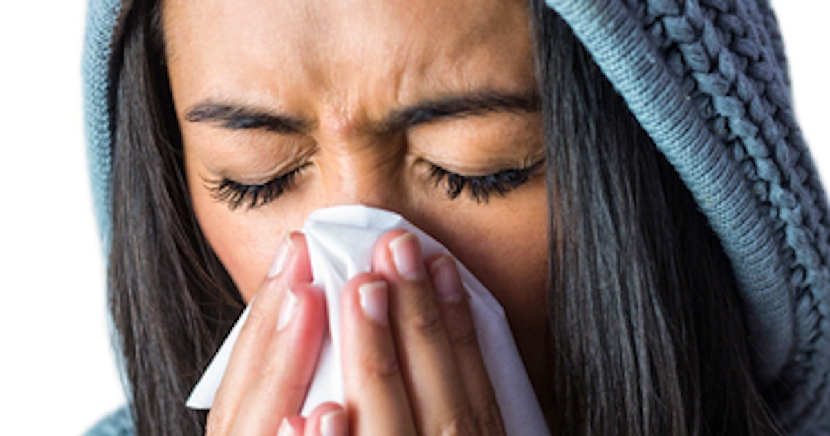 woman sneezing